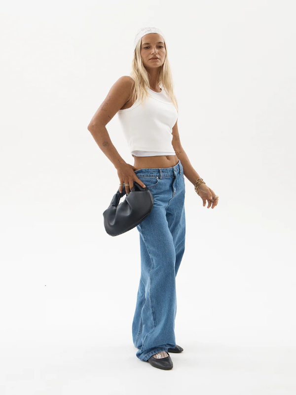 Afends Alyra low rise wide leg women's denim jeans with a relaxed fit.