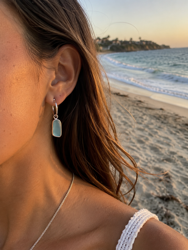 Aqua sea glass earrings featuring a coastal-inspired handmade design.