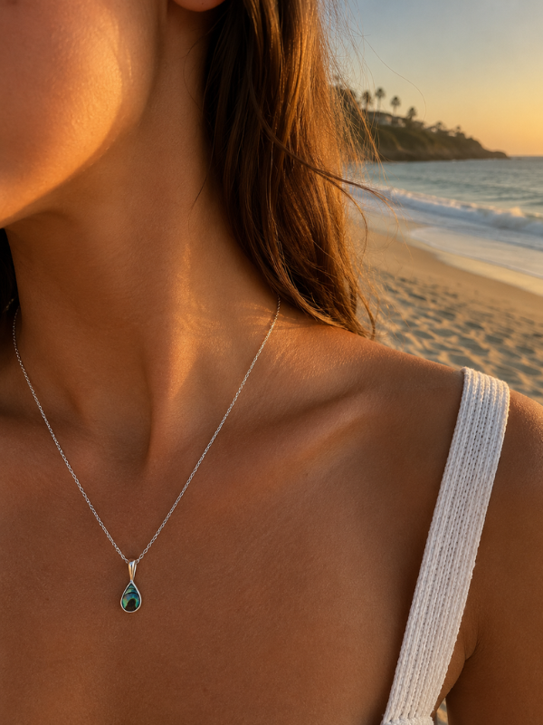 Handmade abalone shell necklace featuring natural iridescent shell detailing and a coastal-inspired design.
