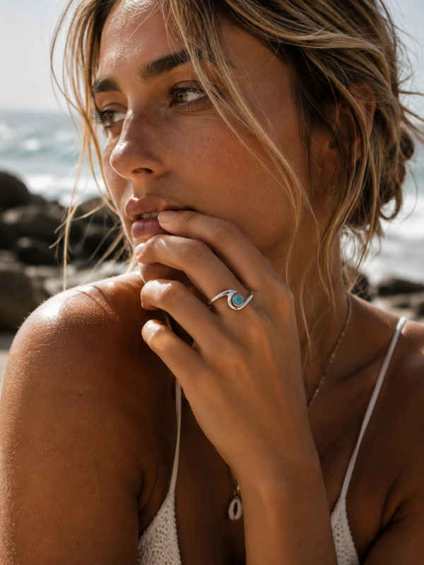 Handmade 925 sterling silver wave ring featuring natural Larimar stone with unique blue colouring and pattern.