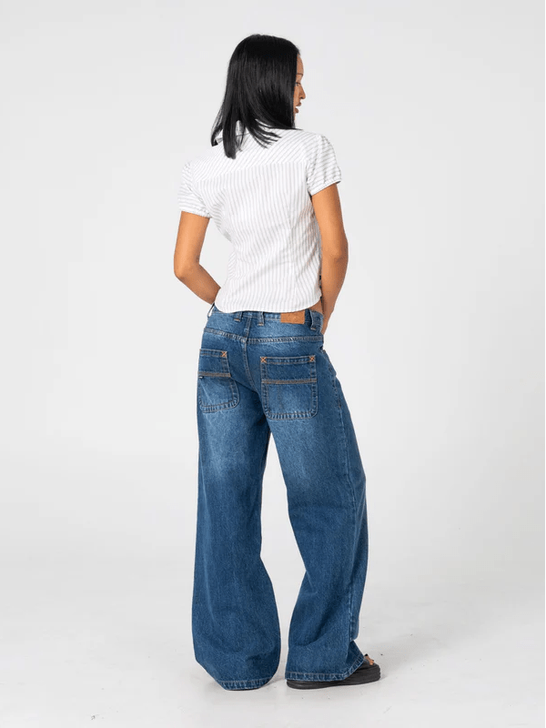 RUSTY RIP IN WENDY WIDE LOW RISE DENIM JEAN