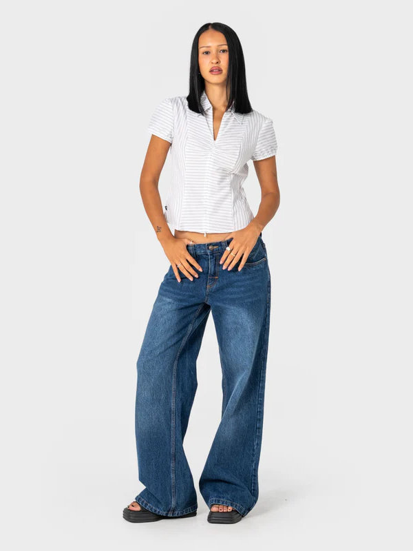RUSTY RIP IN WENDY WIDE LOW RISE DENIM JEAN