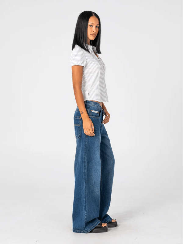 RUSTY RIP IN WENDY WIDE LOW RISE DENIM JEAN