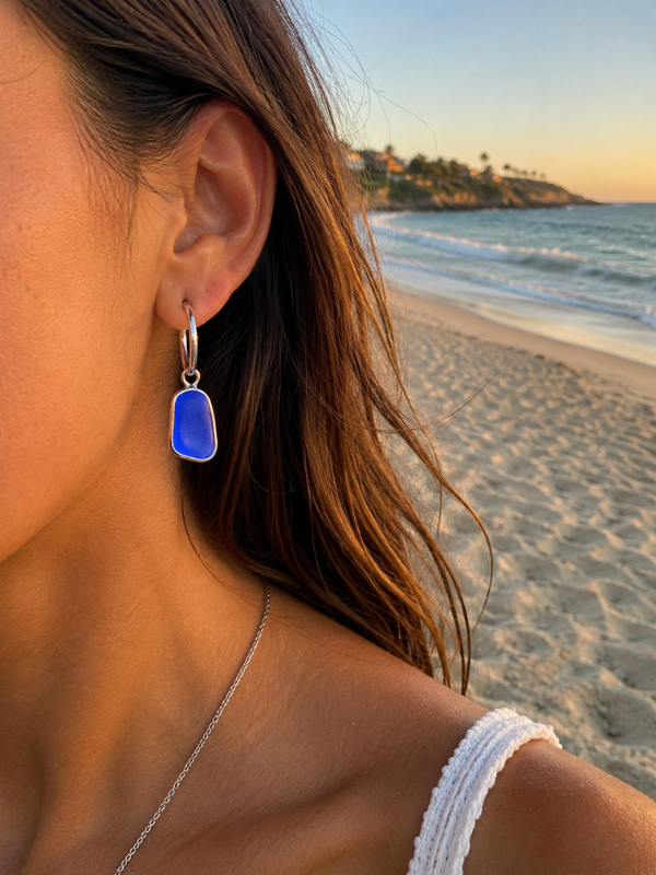 Marine sea glass earrings featuring a coastal-inspired handmade design.
