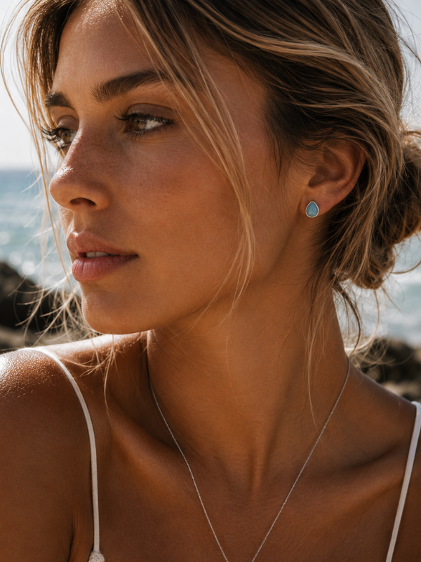 925 sterling silver teardrop stud earrings featuring natural Larimar stone with unique blue colouring and pattern.