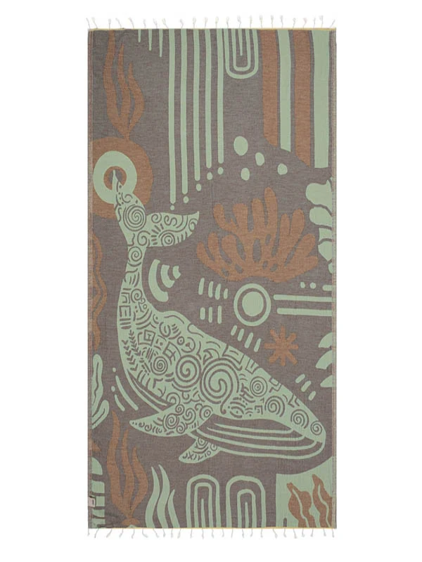 Sand Cloud Moby The Whale organic cotton beach towel featuring a coastal whale design.