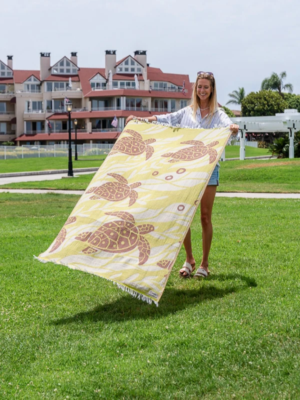 Sand Cloud Sargasso organic cotton beach towel featuring a coastal-inspired design.